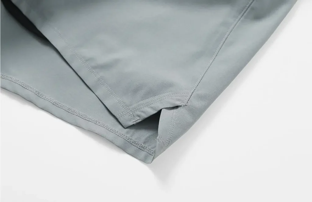 athletic shorts manufacturer light gray athletic shorts hem and split detail