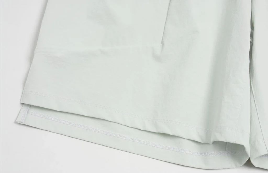 gym shorts manufacturer light gray eco-friendly gym shorts hem and lining detail