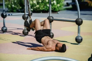 Man performing outdoor strength training wearing black custom gym shorts produced by a professional custom gym shorts factory